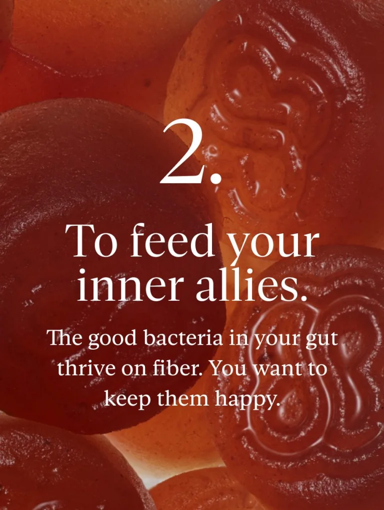 Close-up of Sakara Fiber Bite gummy with text overlay stating that the product helps "To feed your inner allies."