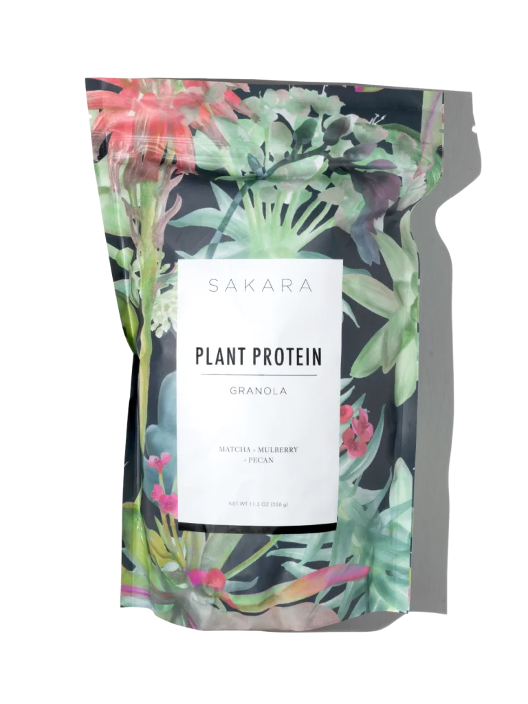 Sakara Plant Protein Granola in resealable pouch with tropical botanical print, matcha mulberry pecan flavor, 11.5 oz (326 g).