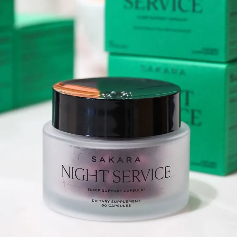 Night service sleep support capsule packaging against a blurry background